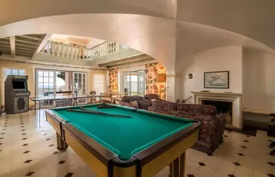 a living room with a pool table in it at Casa da Vigia - waking up in front of the sea in Albufeira