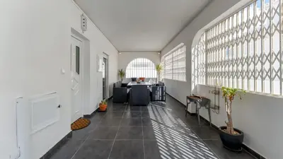 an empty hallway with a living room and a table at Cozy 2BR near Oura Beach by LovelyStay in Albufeira