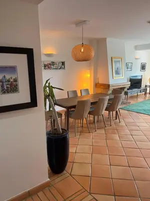 a dining room with a table and chairs at SomeSunnyDay Vila Sol Village in Quarteira