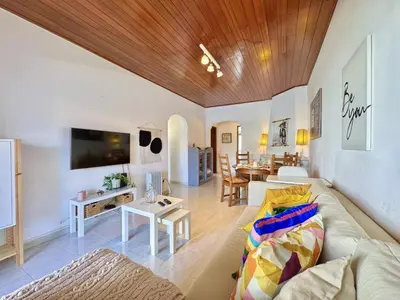 a living room with a couch and a table at Vilamoura Golf Apartment 2 With Pool by Homing in Vilamoura
