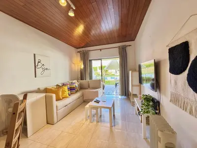 a living room with a couch and a table at Vilamoura Golf Apartment 2 With Pool by Homing in Vilamoura