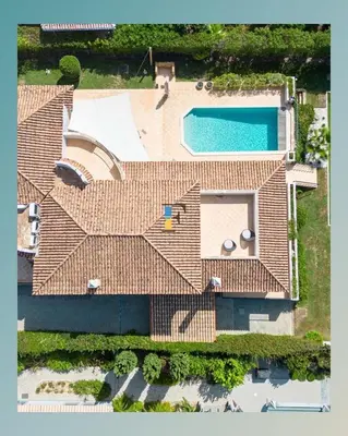 an aerial view of a house with a swimming pool at The Beverly Vilamoura in Quarteira