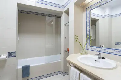a bathroom with a sink and a shower at Dream place- Bela Vista in Albufeira