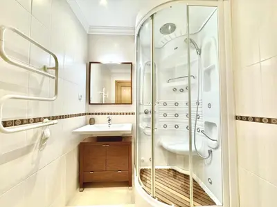 a bathroom with a shower and a sink at Vilamoura Beach Village 1 With Pool by Homing in Vilamoura