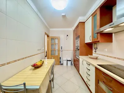a kitchen with a wooden counter top in a room at Vilamoura Beach Village 1 With Pool by Homing in Vilamoura
