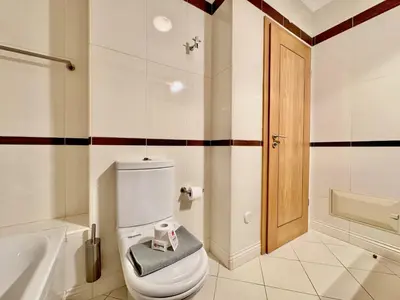 a bathroom with a toilet and a sink and a tub at Vilamoura Lovely Beach Stay With Pool by Homing in Vilamoura