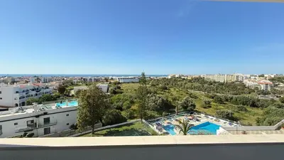 a view from the roof of a building with a swimming pool at Cozy Sea View in Albufeira