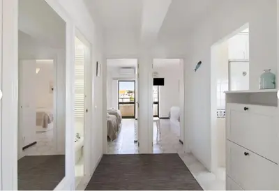 a living room with a tv and a table and chairs at Algarve Paraíso Casa Solimô in Bicas