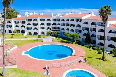 a large apartment building with a large swimming pool at Valmangude - Collection design par Enjoyyourstay in Albufeira