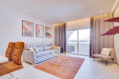 a living room with a couch and a table at Valmangude - Collection design par Enjoyyourstay in Albufeira