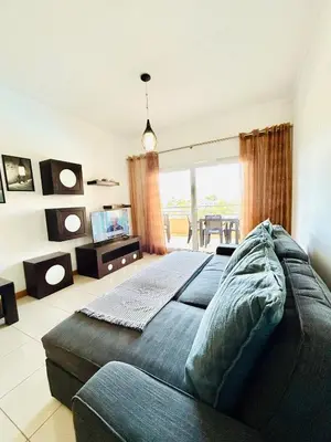 a bedroom with a large bed and a couch at Albufeira Comfort Luxury Quinta Barracuda in Albufeira