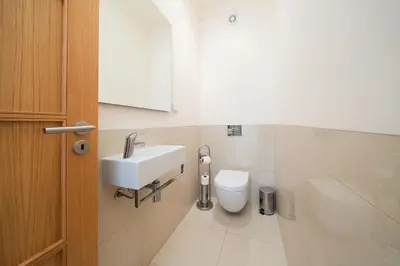 a bathroom with a sink and a toilet at Palmyra Apartments in Vilamoura in Vilamoura