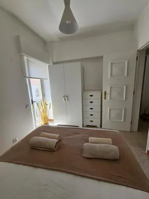 a bedroom with a large bed with two pillows on it at Faro Heart House in Faro