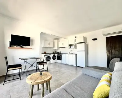 a living room with a couch and a table at Villa Terraza - Center Hideaway in Albufeira