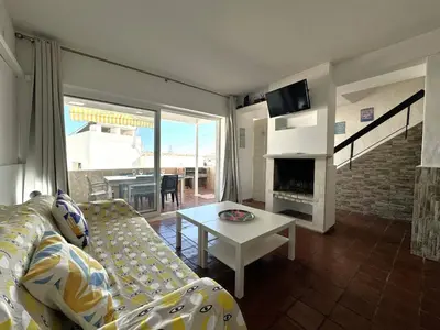 a living room with a couch and a coffee table at Villa Terraza - Center Hideaway in Albufeira