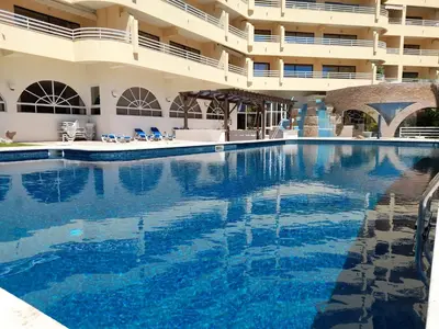 a large swimming pool in front of a building at Marina Mar Sunset by SAPvillas in Vilamoura