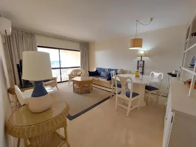 a living room with a couch and a table at Marina Mar Sunset by SAPvillas in Vilamoura
