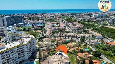an aerial view of a city with a hot air balloon at #275 Only Families - A Flor by Home Holidays in Albufeira