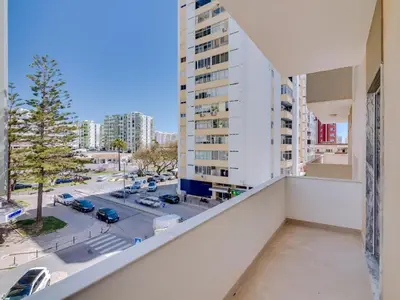 an apartment balcony with a view of a street at Art and Sea 2 bedroom apartment in Quarteira