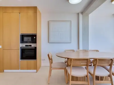 a dining room with a table and chairs at Art and Sea 2 bedroom apartment in Quarteira