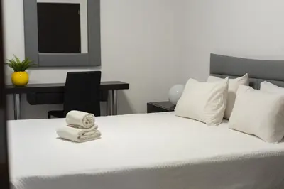 a bedroom with a bed with two towels on it at Fonte Moura - With pool by HD in Vilamoura