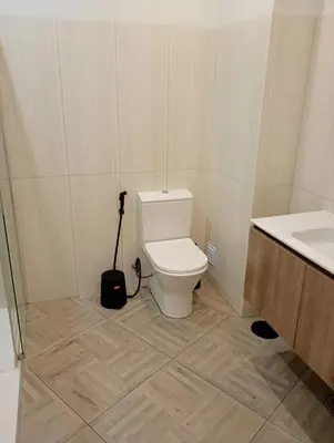 a bathroom with a toilet and a sink at Panoramic View in Albufeira
