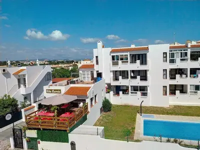 an aerial view of a building with a swimming pool at Central View 990 meters from beach on foot in Albufeira
