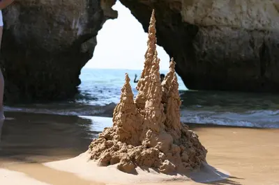 a sand castle on the beach near the ocean at Modern Apartment in Albufeira in Albufeira
