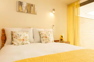 a bedroom with a bed with pillows and a window at Spacious Villa by Algarve Dream Holidays in Albufeira