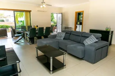 a living room with a couch and a table at Spacious Villa by Algarve Dream Holidays in Albufeira