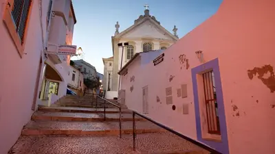 an alley with stairs and a building with a tower at Spacious Villa by Algarve Dream Holidays in Albufeira