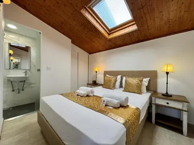 a bedroom with a large bed with a skylight at Vilamoura Marina View 2 by Homing in Vilamoura