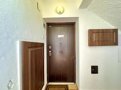 a brown door with a clock on the side of a building at Vilamoura Marina View 2 by Homing in Vilamoura