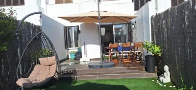 two bikes parked against a wall next to a swimming pool at Casa do Baco - Private Pool in Quarteira