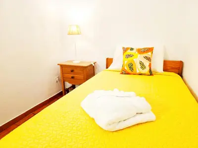 a living room with a couch and a table at Corte Real Apartment O - Sea & Old Town View in Albufeira