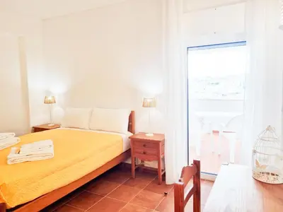 a table with two plates of food on a balcony at Corte Real Apartment O - Sea & Old Town View in Albufeira