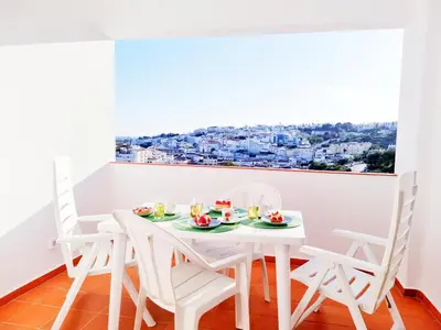 a white bathroom with a shower and a toilet at Corte Real Apartment O - Sea & Old Town View in Albufeira