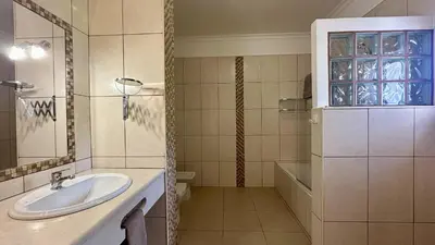 a bathroom with two sinks and a large mirror at Casa do Campo by Check-in Portugal in Tunes