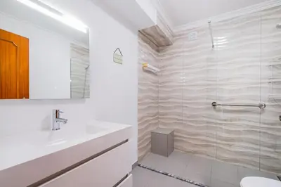 a bathroom with a sink and a shower at Old Town Soul in Albufeira