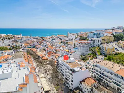 an aerial view of a city with buildings and the ocean at Old Town Soul in Albufeira