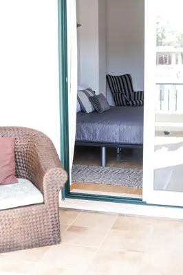 a living room with a couch and a chair at Silver Globe in Albufeira