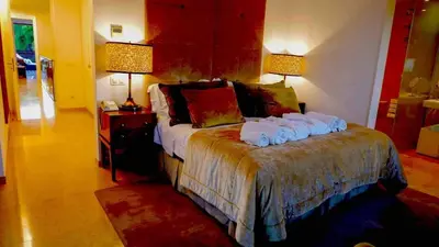 a bedroom with a bed with towels on it at Serenity-First villa in Albufeira