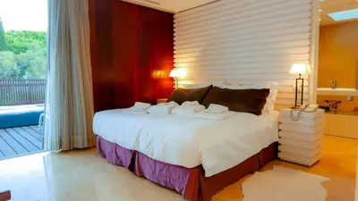 a bedroom with a bed with towels on it at Serenity-First villa in Albufeira