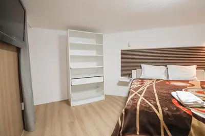 a bedroom with a bed and a television in it at Solar do Golf T1 Vilamoura Old Village in Quarteira