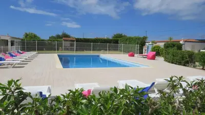 a swimming pool with lounge chairs and a swimming pool at Maison A Quinta V1 4 Personnes in Ferreiras