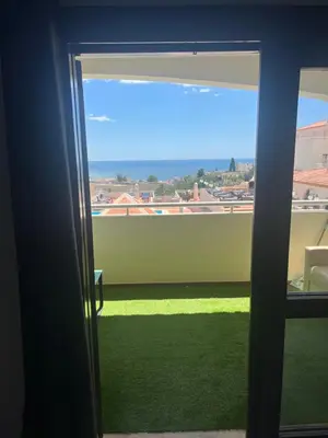 a room with a window with a view of a yard at Amazing Sea View Studio w Pool in Albufeira
