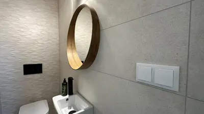 a bathroom with a sink and a mirror on the wall at Cruzeiro by Check-in Portugal in Quarteira