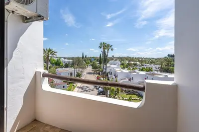 a balcony with a view of a resort at Sunny Flat with a Balcony & Pool by HostWise in Albufeira