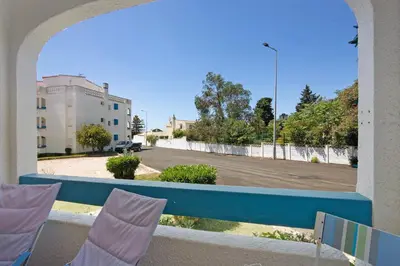 a balcony with a view of a parking lot at Santiago’s Oura House in Albufeira
