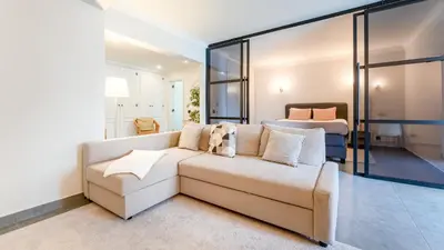 a living room with a couch and a bed at Modern Studio with Balcony in Salgados by Lovelystay in Guia